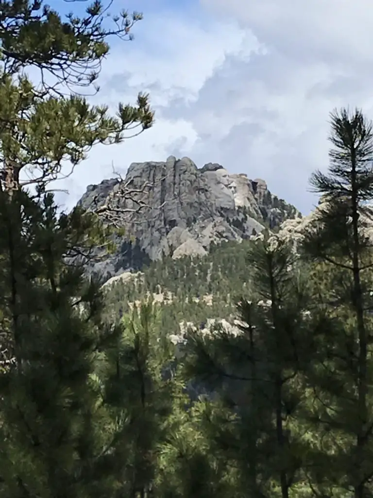 Mt. Rushmore as seen through a break in the trees