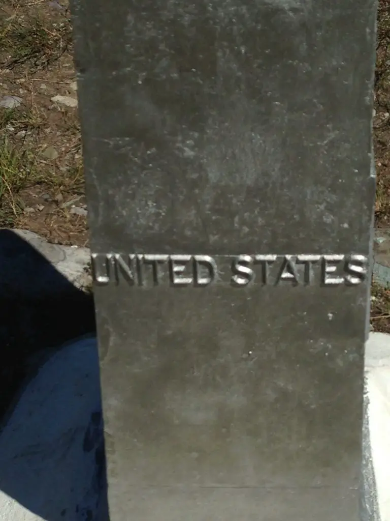 Metal pillar with "United States" written on it