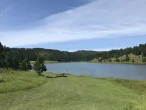 a lake with mountain backdrop
