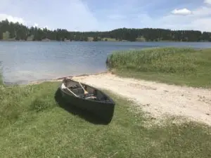 canoe on a lake's shore