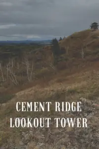 Dunn-colored rocks, dry grass and bare trees cover this mountainside. Pin reads, "Cement Ridge Lookout Tower" 