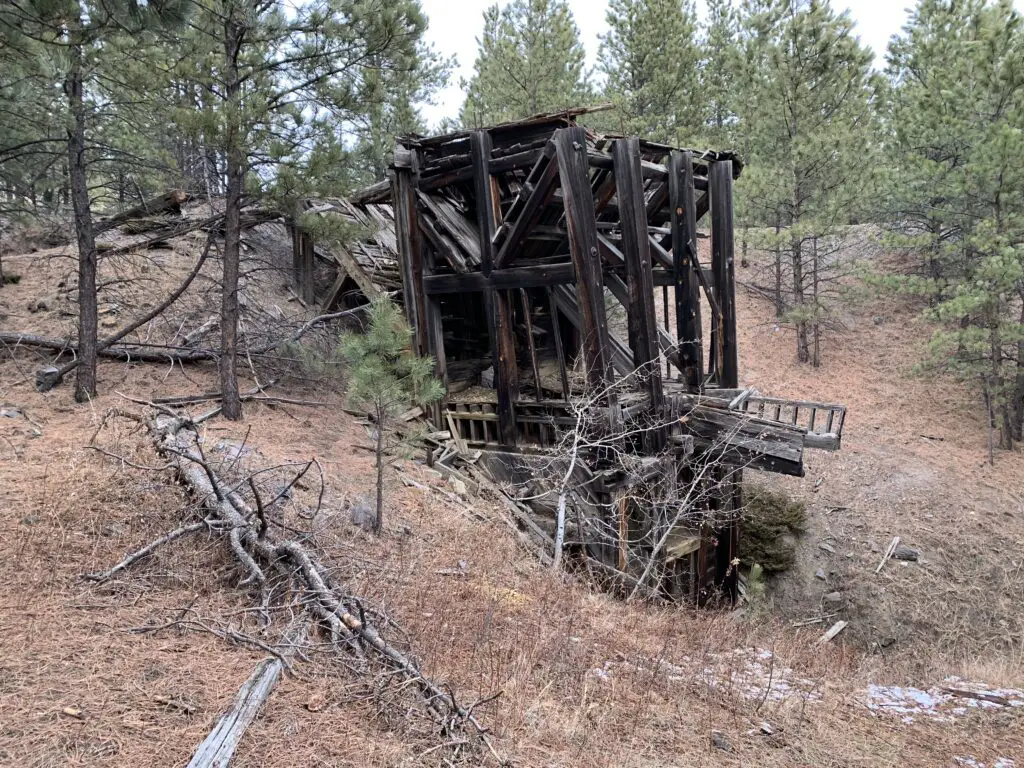 Wooden remains of a mine building in the woods