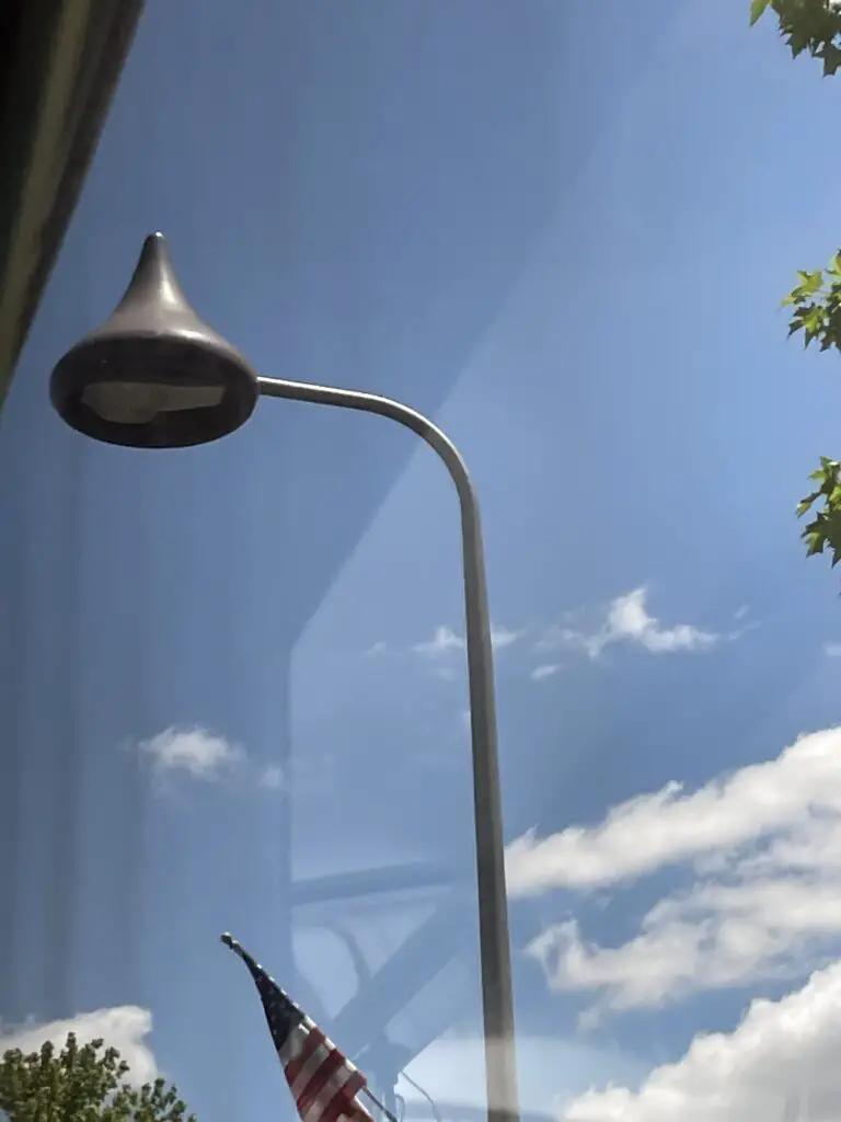 View through a window of a streetlamp that looks like a Hershey's Chocolate Kiss