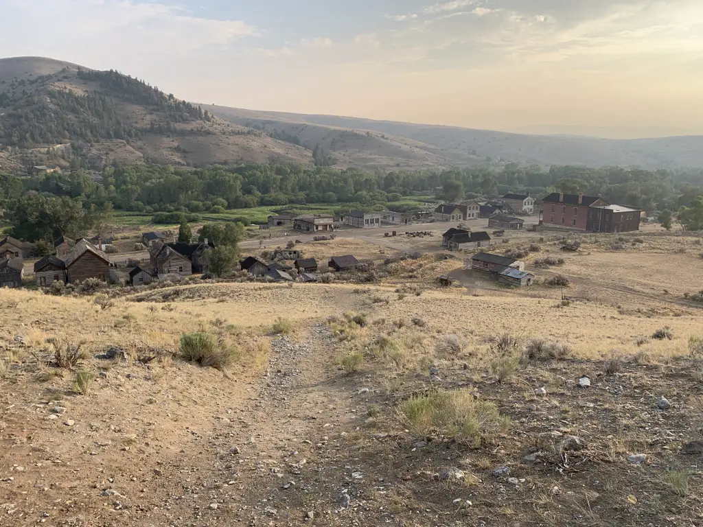 View from top of hill overlooking the ghost town of Bannack, Montana. Smoky mountains in background.