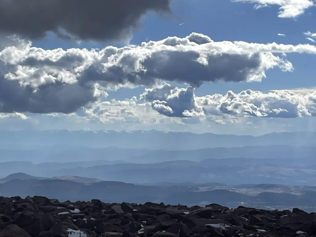 Smoky view of slightly snow-covered mountains in the far distance