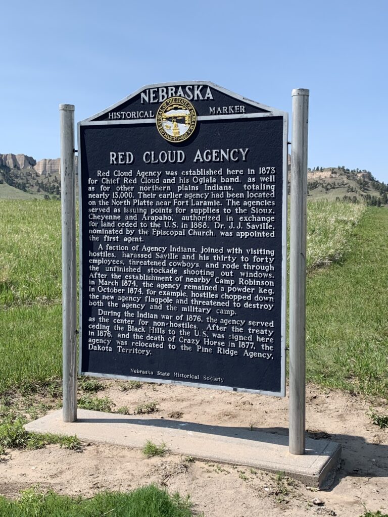 A historical sign describes the Red Cloud Agency--a former American Indian reservation that was located at this spot. 