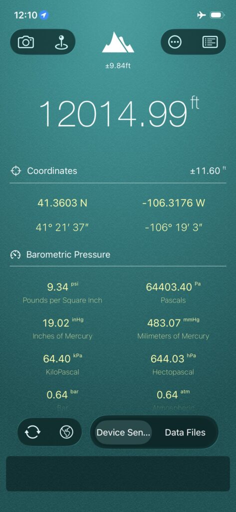 A smartphone app screen displays an altitude of 12,014.99 ft, GPS coordinates, and various barometric pressure readings in multiple units.